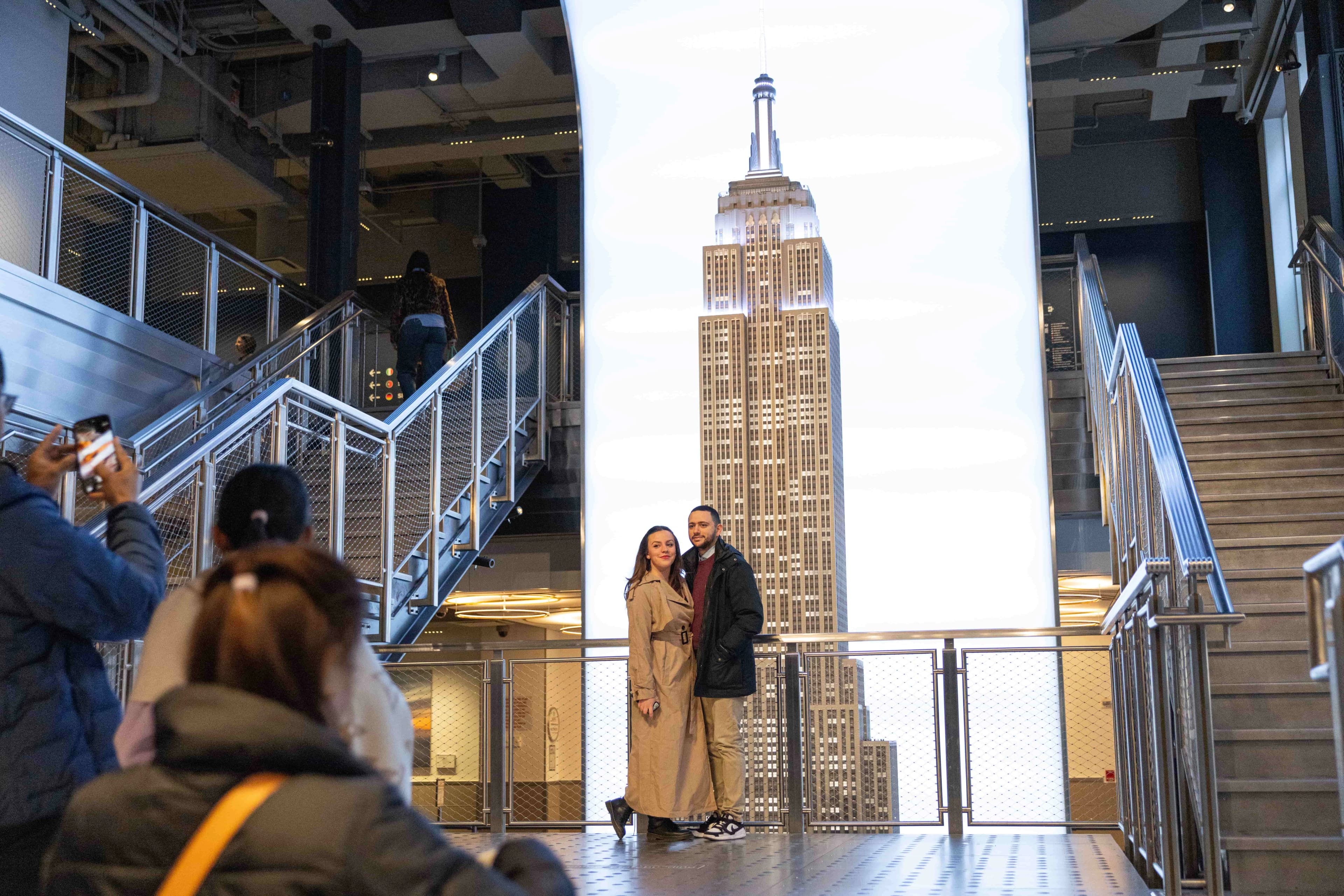 People taking photos at the Empire State Building's Grand Staircase