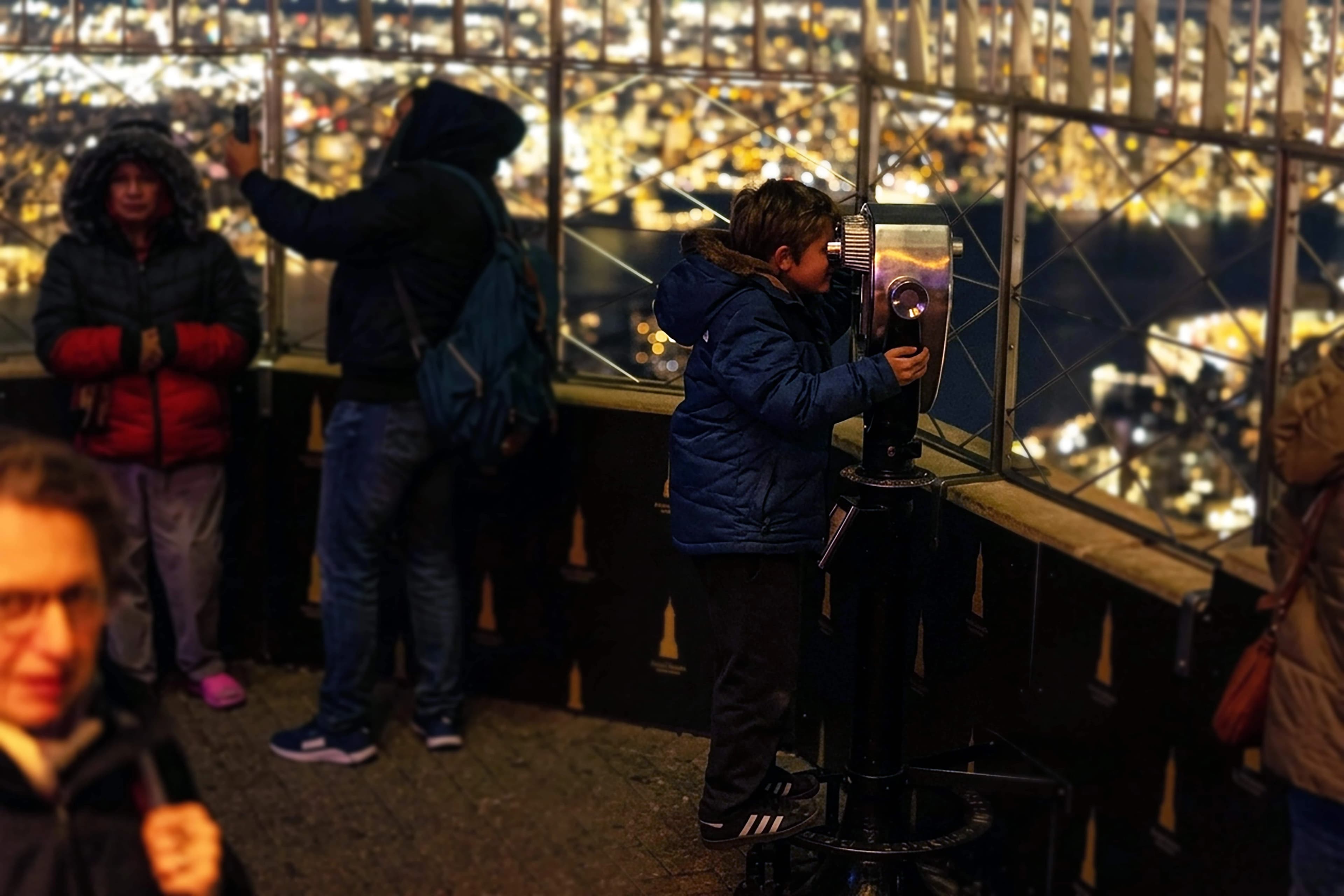 Kid looking through viewfinder at night