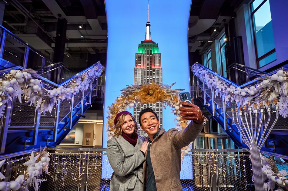 Guests pose with holiday decor at ESB