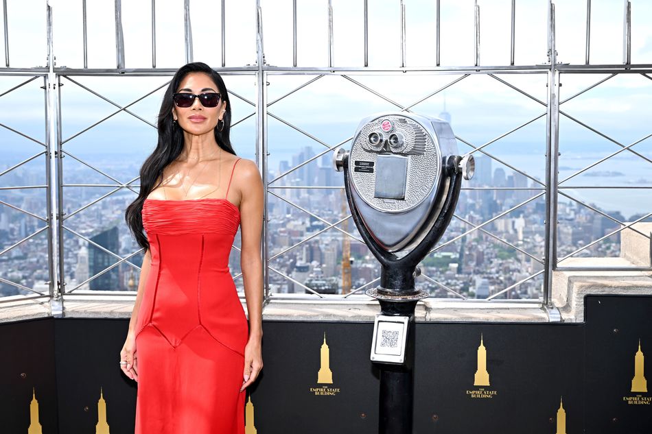 Nicole Scherzinger poses on the 86th Floor Observatory