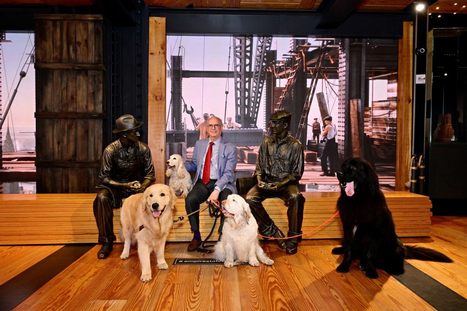 CEO Denis Sprung and AKC dogs pose at the Construction exhibit