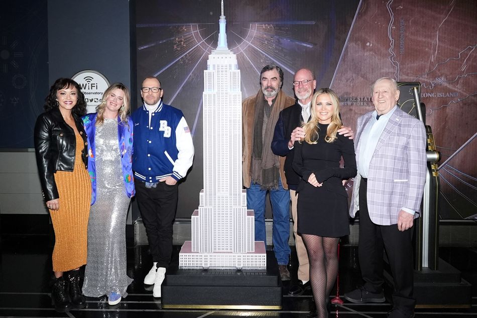 The cast of "Blue Bloods" poses with the small ESB model