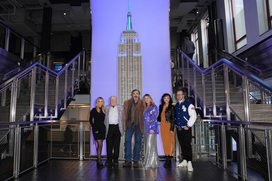 The cast of "Blue Bloods" with the large ESB model