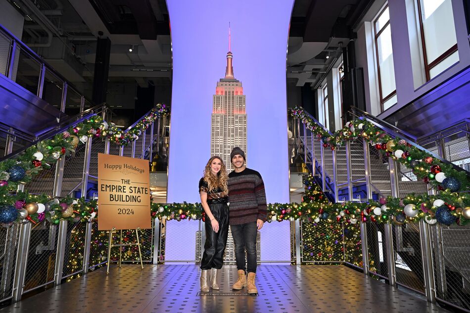 Carlos and Alexa PenaVega with the two-story ESB model