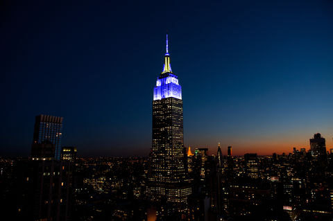 ESB lights in blue and yellow for Chuck Scarborough's 50th On-Air Anniversary