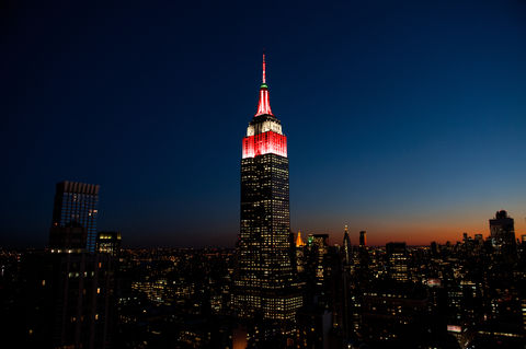 The Empire State Building in red, white, and green.