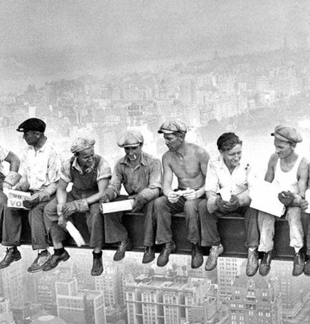 builders sitting on empire statebuilding steel